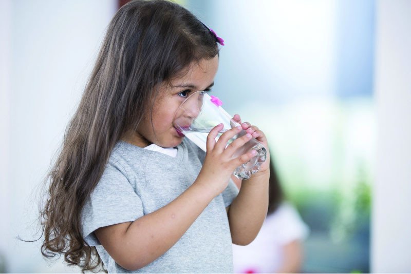 Little girl drinking water